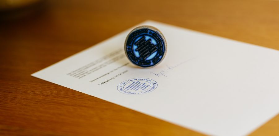 Traduction certifiée avec cachet et signature de Regine Baum
